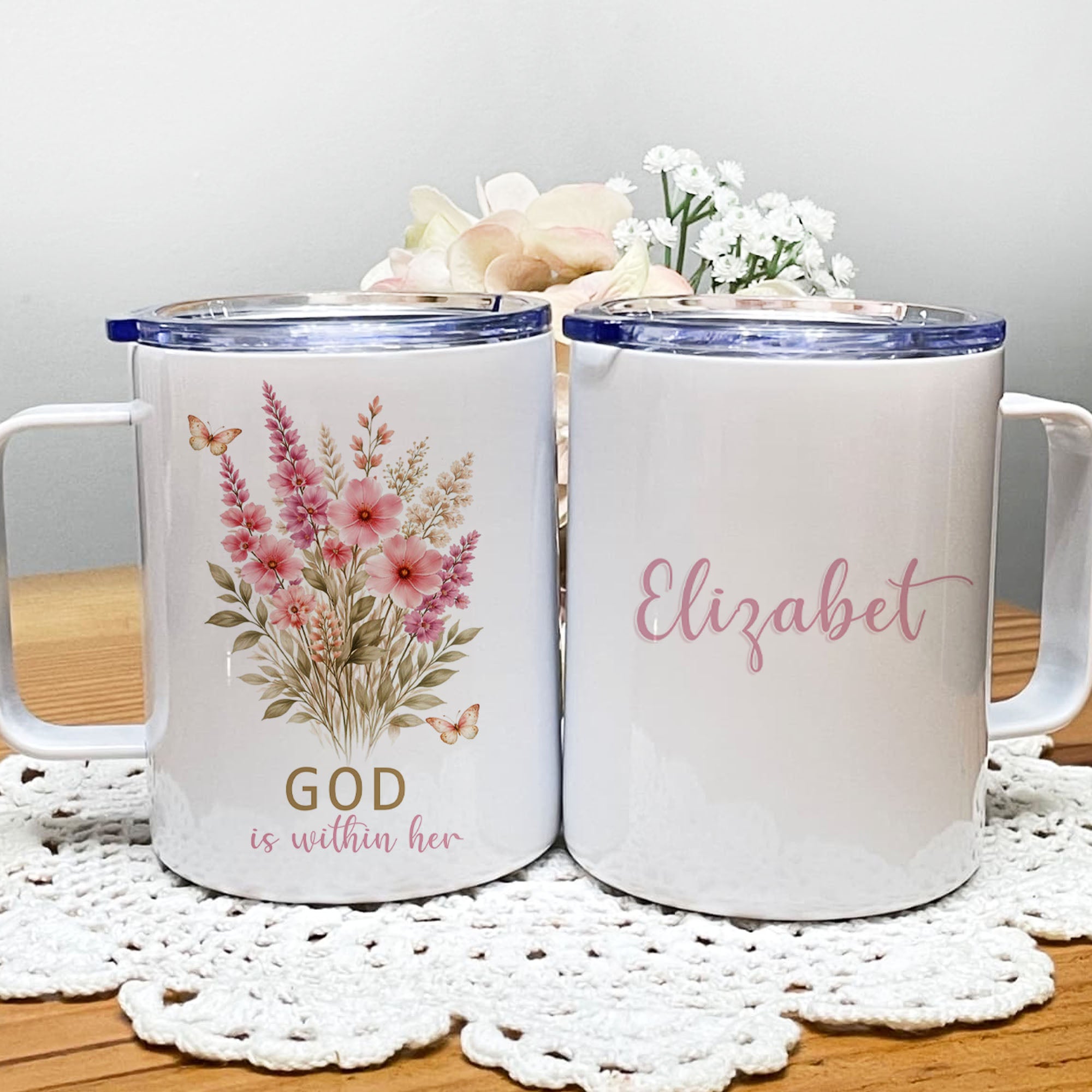 Minimalist 12oz Christian insulated travel mug featuring a soft floral design and the uplifting scripture phrase "God is within her" on a clean background.