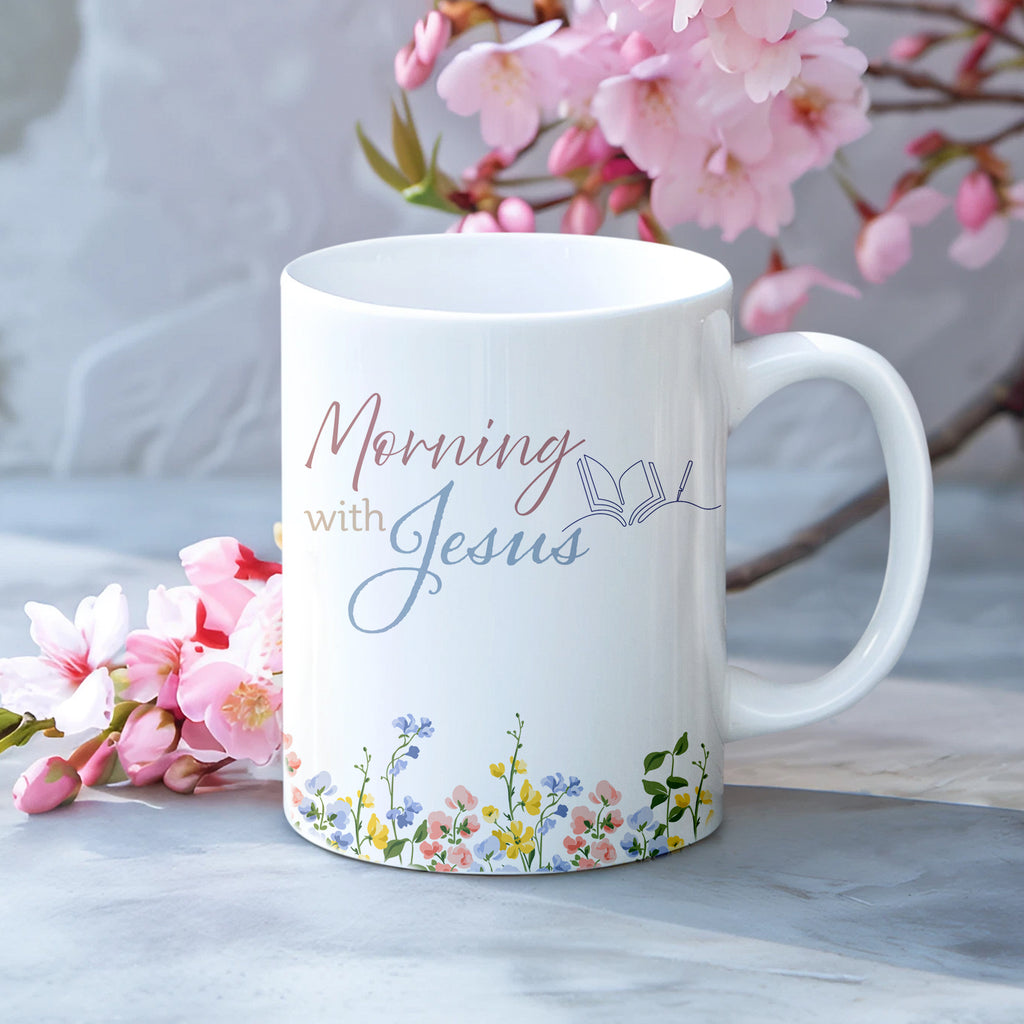 Personalized Christian coffee mug for women featuring a minimalist wildflower design and the text "Mornings with Jesus", shown as an elegant 15oz mug set with a bamboo lid and gold spoon on a clean background.